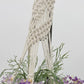 Natural Beauty: Silk Wisteria and Sea Grass Hanging Planter in Ceramic Pot with Macrame Hanger